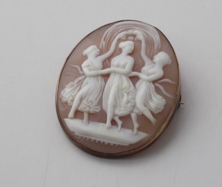 A 19th Century cameo shell carved brooch decorated The Three Graces