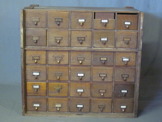 A Globe Wernicke oak card index filing chest of 30 drawers 39"