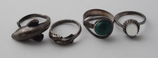A silver dress ring in the form of a dolphin, do. 2 dolphins, a silver dress ring set a blue stone and 1 other set a turquoise