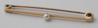 A 14ct gold bar brooch set a pearl