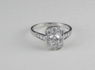 An 18ct white gold Art Deco style dress ring set diamonds and  with diamonds to the shoulders, approx 1.20ct