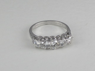 A lady's 18ct white gold dress/engagement ring set 5 diamonds,  approx 1.30ct