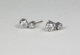 A pair of lady's diamond drop earrings set diamonds, approx 1ct