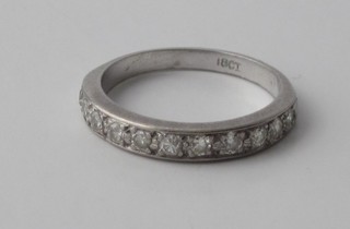 A lady's 18ct white gold half eternity dress ring set diamonds