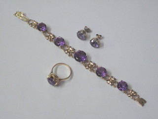 A Russian suite of amethyst and gilt metal jewellery comprising pair of earrings, ring and a bracelet
