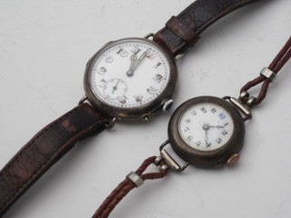 A lady's and a gentleman's wristwatch contained in silver cases