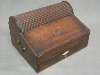 A 19th Century mahogany writing slope with domed stationery  box fitted a tambour shutting, having brass drop handles to the  sides 13"