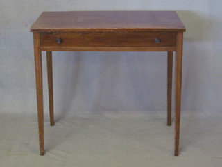 An Edwardian rectangular mahogany side table fitted a frieze  drawer and raised on square tapering supports 30"