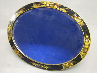 An oval bevelled plate easel mirror contained in a black  lacquered chinoiserie style frame 17"