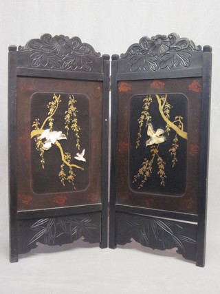 A Eastern carved ebonised and lacquered inlaid 2 fold screen, decorated birds amidst branches, 32"