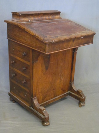 A Victorian inlaid walnut Davenport desk fitted a stationery box, the pedestal fitted 4 long drawers 22"