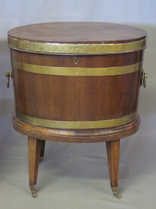 An oval Georgian mahogany cellarette with brass banding and hinged lid, 21"  ILLUSTRATED