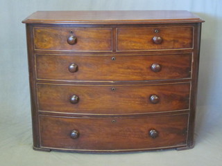 A Victorian mahogany bow front chest of 2 short and 3 long  drawers with tore handles, legs removed but within a drawer, 47"