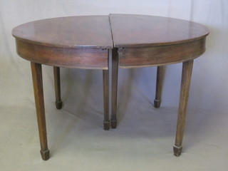A Georgian mahogany D end dining table with 1 extra leaf,  raised on 6 square tapering supports ending in spade feet 69"
