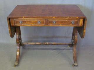 A Georgian style yew sofa table fitted 2 drawers, raised on lyre lyre supports, 36"