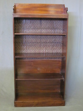 An Edwardian mahogany bookcase with three-quarter gallery, the  interior fitted adjustable shelves, 28"