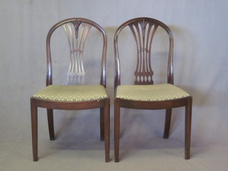 A pair of mahogany Hepplewhite style dining chairs with  upholstered drop in seats