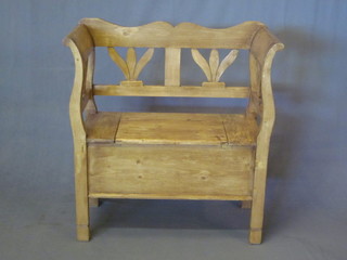 A Continental stripped and polished pine settle 34"