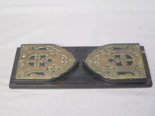 A pair of Victorian ebonised bookends with brass mounts 13"