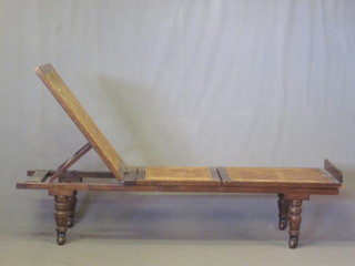 A Victorian mahogany framed adjustable folding day bed with woven cane panels by Leveson & Sons