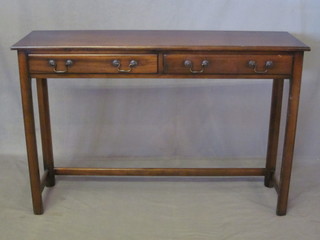 A Georgian style mahogany side table fitted 2 long drawers with  swan neck drop handles, raised on square supports 42"