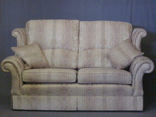 A modern 3 piece winged settee suite comprising 2 seat settee,  matching armchair and footstool 56"