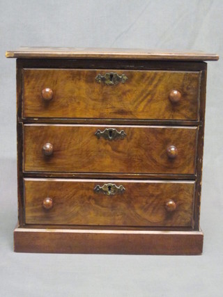 A Victorian walnut "apprentice" chest of 3 long drawers with  tore handles 11"