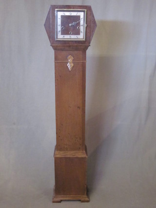 An Art Deco 8 day striking longcase clock with square silver plated dial contained in an oak case by Enfield 53", some old  worm holes,