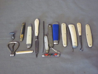 2 button hooks, a metal seal and 10 various pocket knives etc