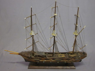 A wooden model of a 3 masted sailing ship 24"