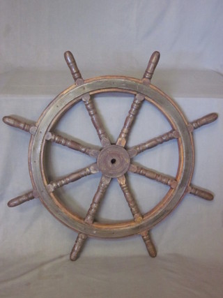 A wooden and metal 8 spoked ships wheel 30"