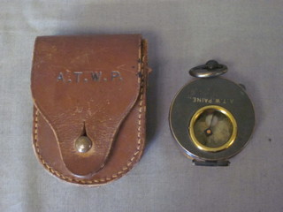 A prasmatic compass by Negretti and Zambra, complete with  leather case