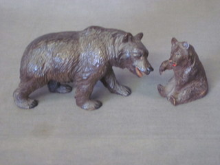 A carved Swiss wooden figure of a walking bear 6" and 1 other  seated bear 3"