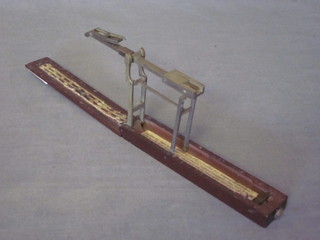 A brass balance contained in a mahogany case 5 1/2"