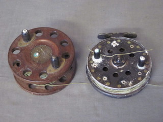 An aluminium centre pin fishing reel 4" and a section of wooden fishing reel 4"