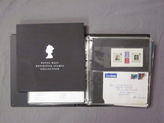 The Royal Mail definitive stamp collection and a black album of  first day covers