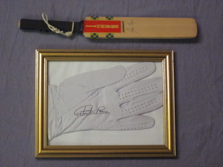 A signed white leather golf glove and a miniature Gary Nichols cricket bat signed by John Major