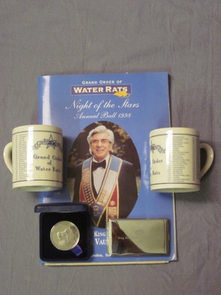 A 1941 Grand Order of Water Rats souvenir menus signed by  various celebrities attending the evening, together with a 1998  Annual Ball programme, a silver plated card case, a Grand Order  of Water Rats Centenary medal and two Grand Order of Water  Rats mugs