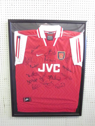 A Nike Arsenal shirt signed by various players, framed