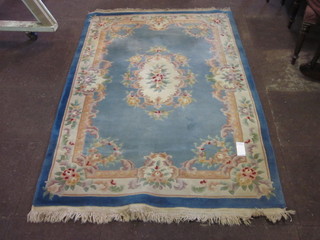 A blue ground and floral patterned Chinese rug 80" x 55"