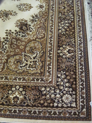 A cream ground floral patterned Persian style rug 140" x 106"