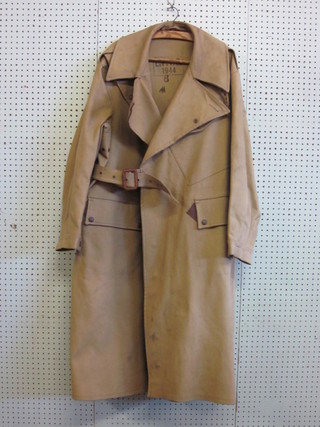 A WWII military issue motorcycle outriders rain coat, size 6, dated 1944