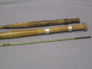 A fibre glass twin section boat rod with spare tip and the base of  a fishing rod marked Harry Powell