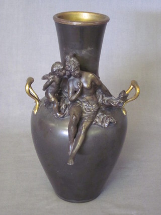 A bronze club shaped twin handled vase decorated a figure of a seated naked lady with cherub 11"