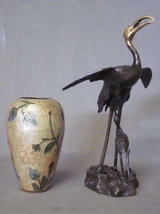 An Oriental bronze figure of a standing stork 13" and a gilt metal  and floral patterned vase 7"