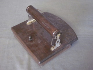 A Continental carved hardwood musical toilet roll holder