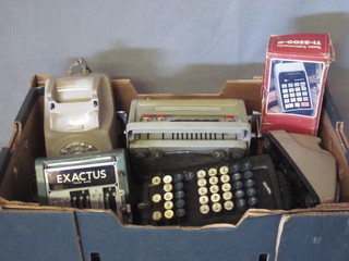 A Facit calculator, an Exactus calculator, 2 others and 2 dial telephones