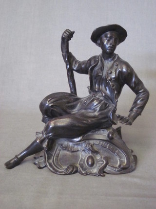 A bronze figure of a seated gentleman 6"