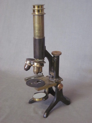 A brass single pillar microscope by Negretti & Zambra
