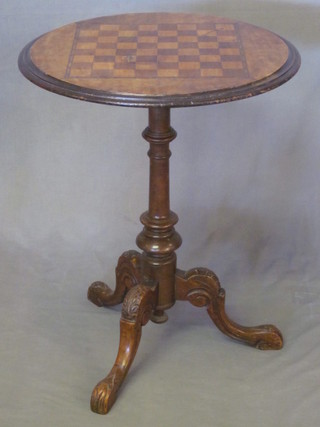 A circular Victorian walnut inlaid chess table, raised on pillar and tripod supports 21"